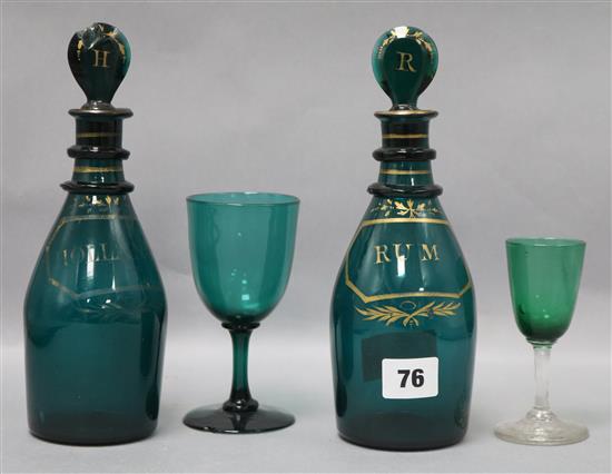 A pair of George III green and gilt glass Rum and Holland decanters and two glasses decanters height 23cm